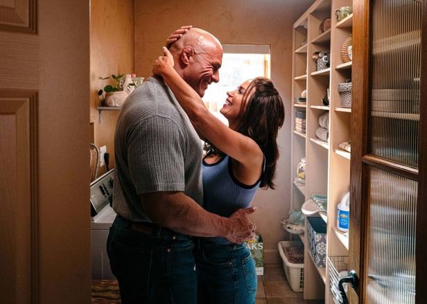 Dwayne Johnson as wrestler Mike Kerr with Emily Blunt