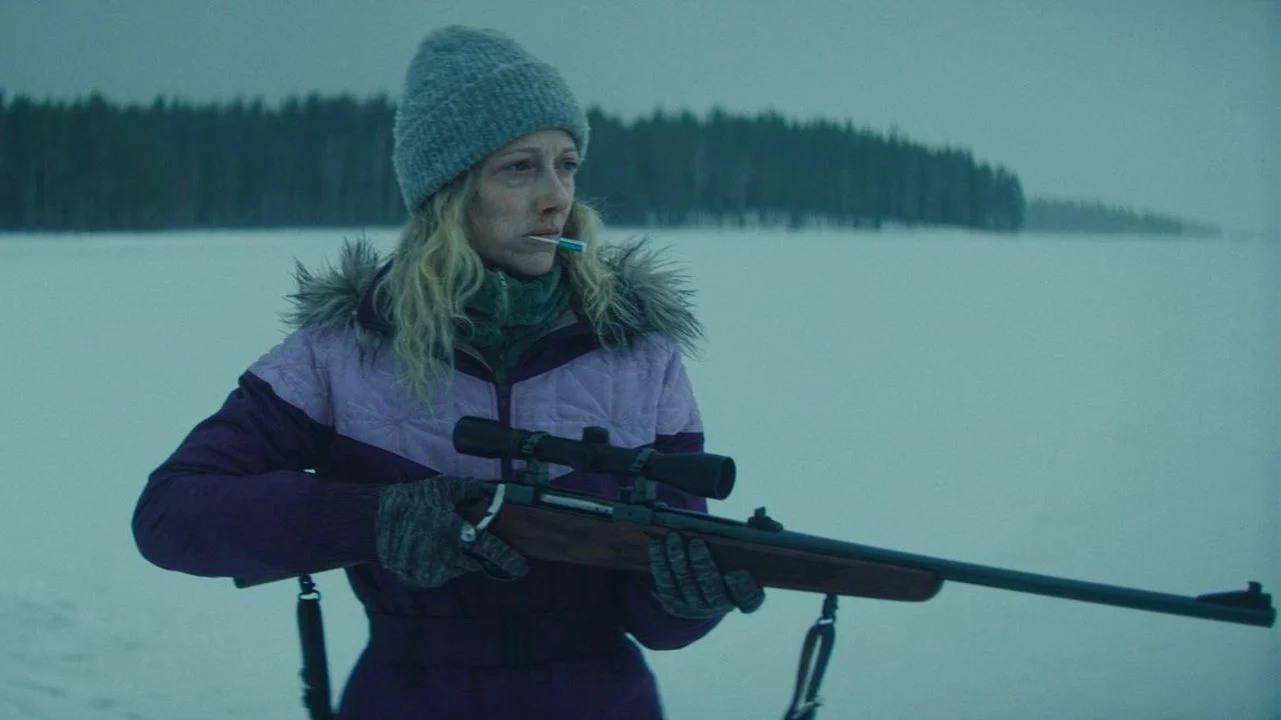 The nameless kidnapper (Judy Greer) doesn't hesitate to use her rifle.