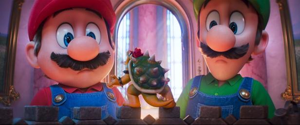 Super Mario and Luigi look at shrunken Bowser