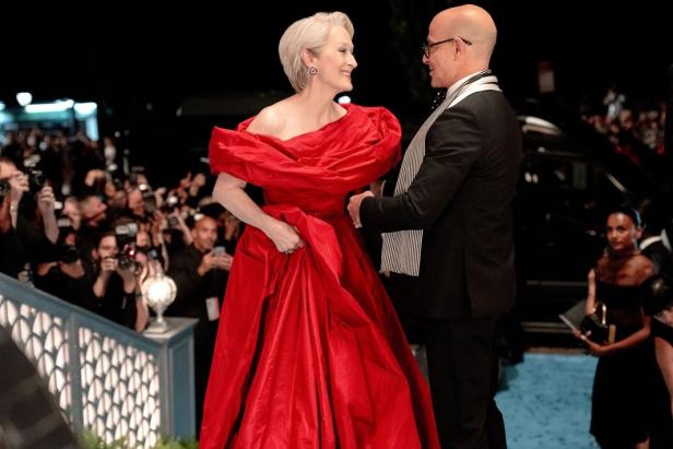 Meryl Streep as Miranda Priestly with Stanley Tucci as Nigel Kipling at her side