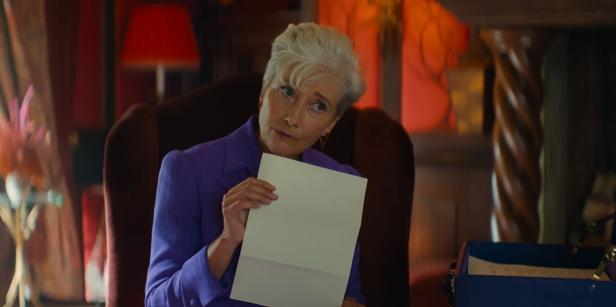 Emma Thompson holds up a piece of paper