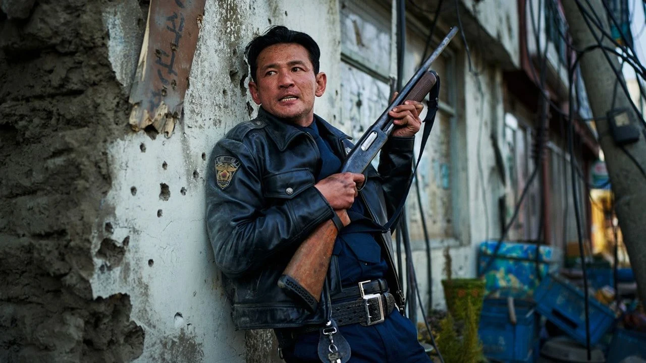 The monster could be lurking around every corner: Cop Bum-seok (Hwang Jung-min) is searching his village.