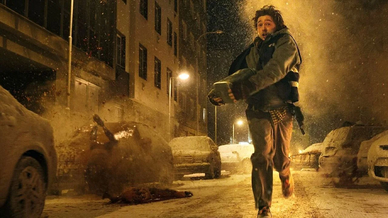 Bryan (Austin Abrams) fights his way through Raccoon City.