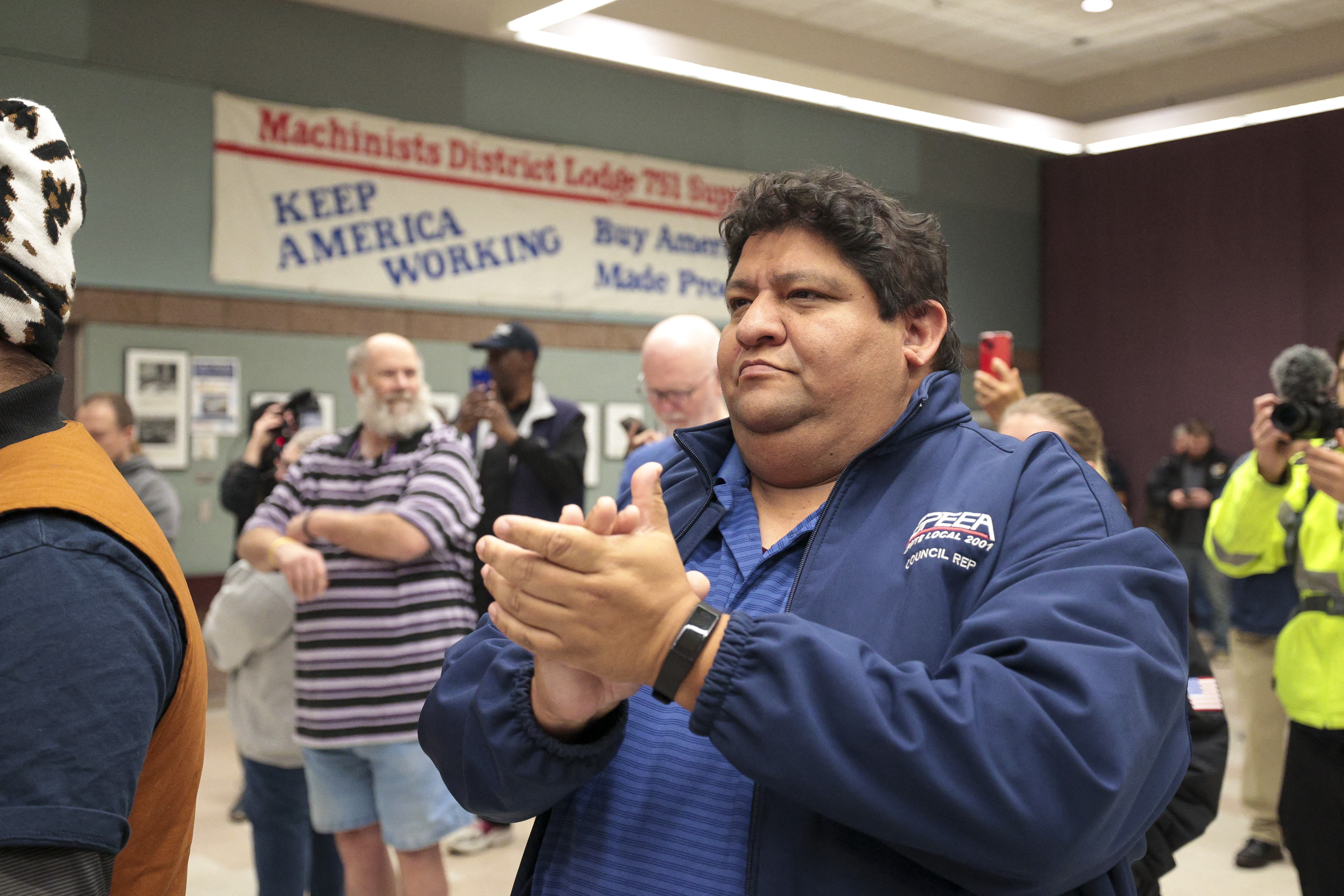Union members and others applaud following the acceptance of a new Boeing contract that ended a 7-week strike in Seattle, Washington, on November 4, 2024.