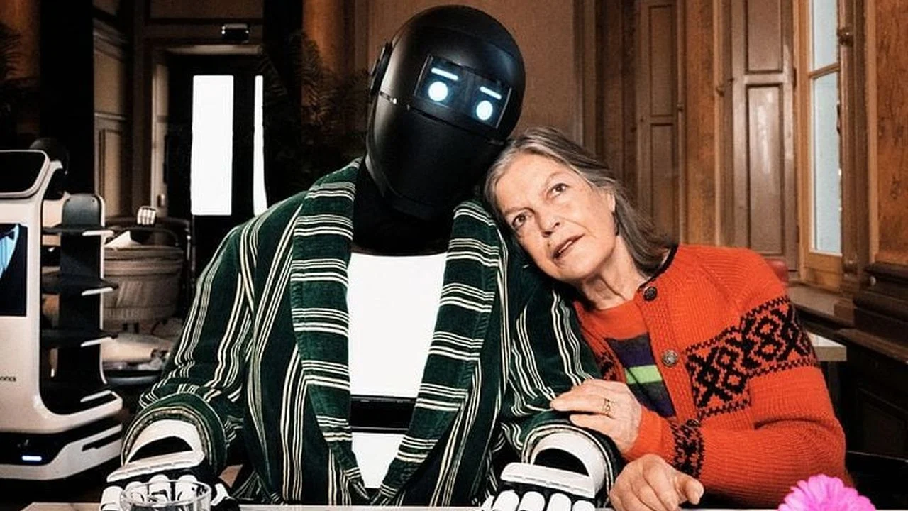 Ms. Winkler's (Angela Winkler) initial skepticism towards her AI care robot Pavlovich (Josef Ellers) doesn't last forever.