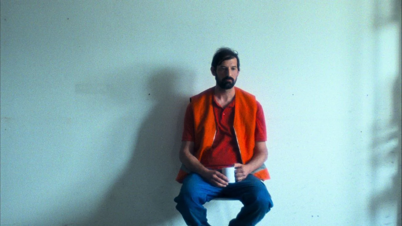 The camera lingers so long in the first shot that you're almost shocked when a second figure comes into the picture.