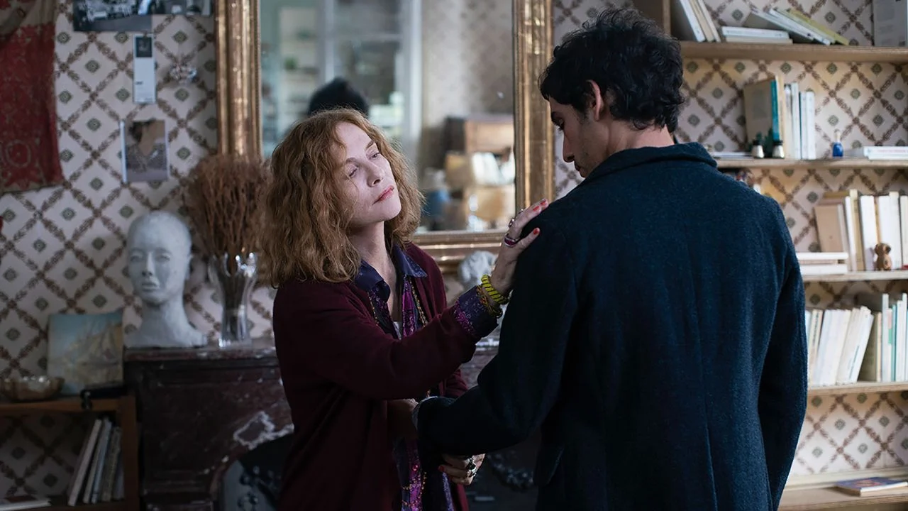 Writer Sylvie (Isabelle Huppert) takes homeless ex-convict Adam (Adam Bessa) under her wing.
