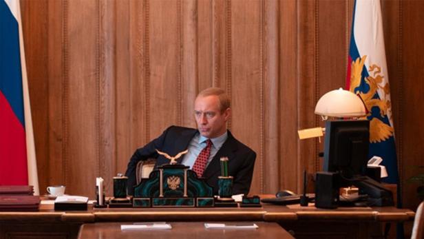 Jude Law as Putin at the desk in film role