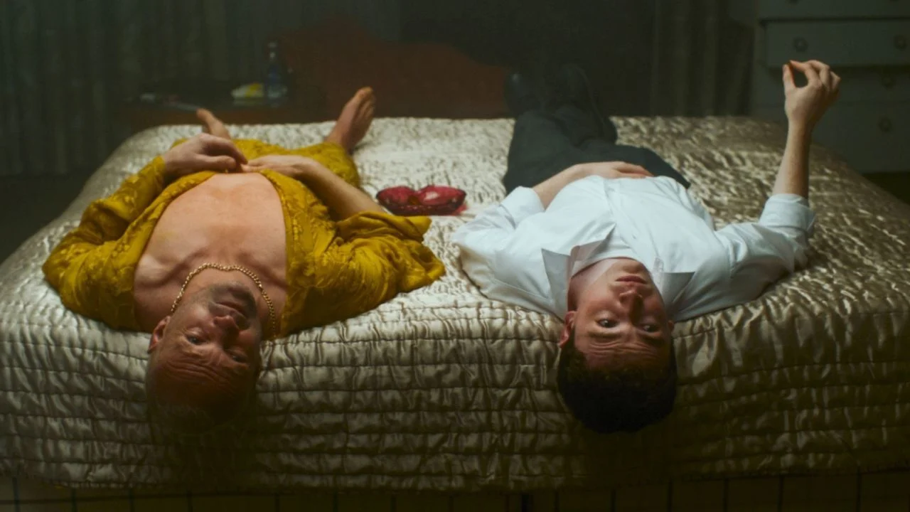 Dylan (Andrew Howard) and son Alec (Caolán O'Gorman) relax together after a successful shoot.