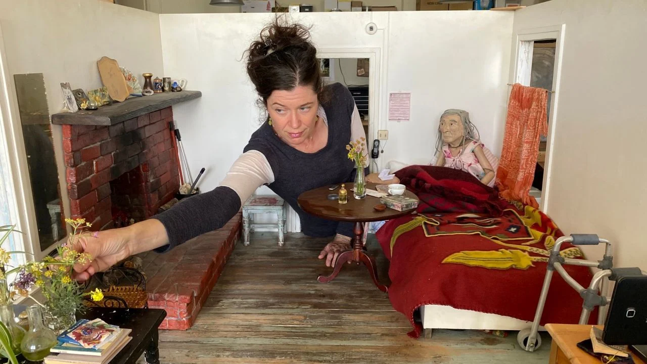 Anna Fitch puts the finishing touches to her 1:3 scale model of her late friend's cottage.